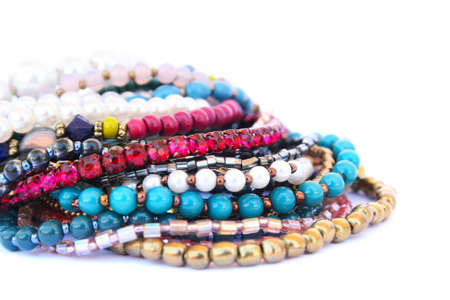 Colorful bracelets and necklaces isolated on white background.の写真素材