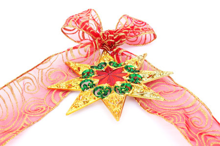 Red ribbon and colorful star isolated on white background.の写真素材