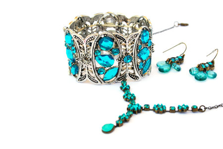 Necklaces, bracelet and earrings  isolated on white background.