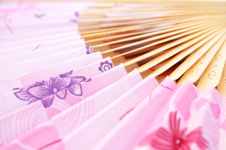 Pink opened fan as a background.の写真素材