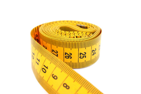 Yellow measuretape isolated on white background.