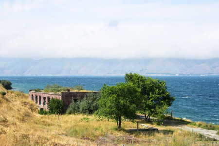 Mountain lake Sevan in Armenia, foggy day.