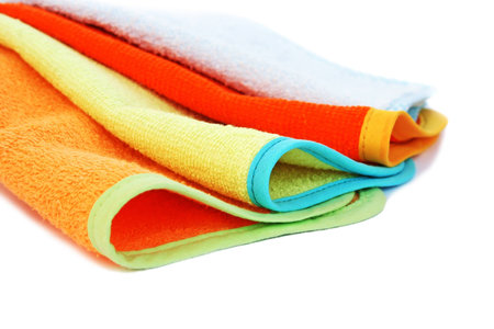 Colorful towels on white background.