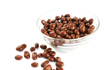 Chocolate with raisins in vase isolated on white background.の写真素材