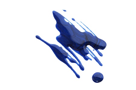 Spilled nail polish isolated on white background.の写真素材