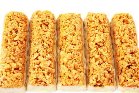 Cereal bars with white chocolate isolated on white background.の写真素材