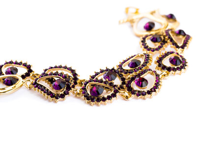 Necklace with violet stones isolated on white background.
