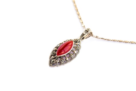 Necklace with red stone isolated on white background.の写真素材