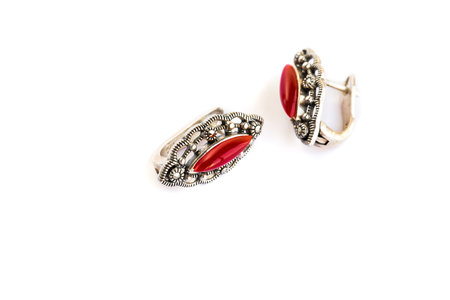 Earrings with red stones isolated on white background.の写真素材