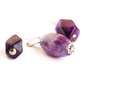 Amethyst earrings and medallion isolated on white background.の写真素材