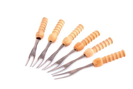 Forks with wooden handles isolated on white background.の写真素材