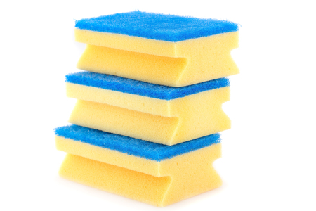 Stack of sponges isolated on white background.の写真素材