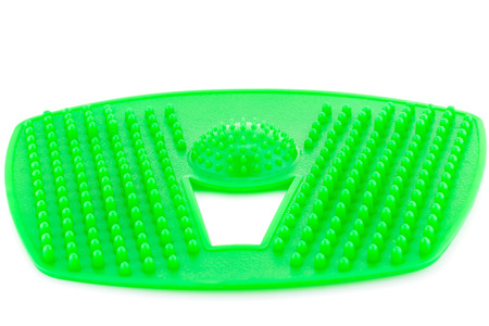 Foot green plastic massage pad isolated on white background.の写真素材