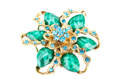 Ancient style brooch with stones isolated on white background.の写真素材