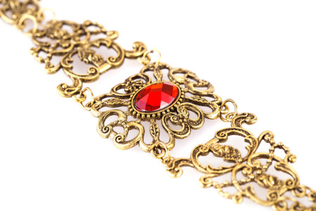 Ancient style bracelet with red stone isolated on a white background.の写真素材