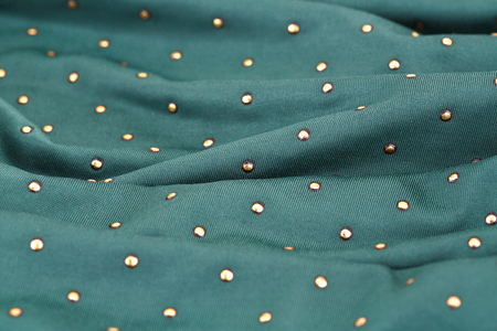 Green fabric background closeup picture.の写真素材
