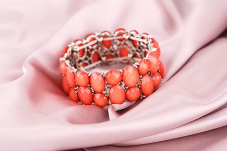 Stylish bracelet with stones on fabric background.の写真素材