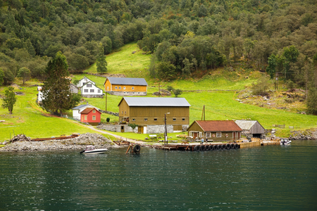 Landscape with Naeroyfjord, mountains and traditional village house in Norway.の写真素材