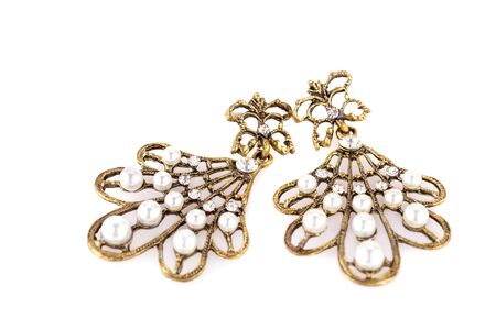 Ancient style earrings isolated on white background.の写真素材