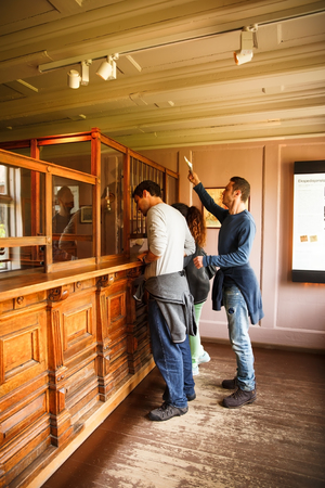 Oslo, Norway-August 13, 2014 - Traditional old bank and people at Norsk Folkemuseum.のeditorial素材