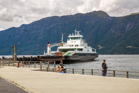 Norway-August 18, 2014 -  Ferry ship with cars and passengers on Norwegian fjord port.のeditorial素材