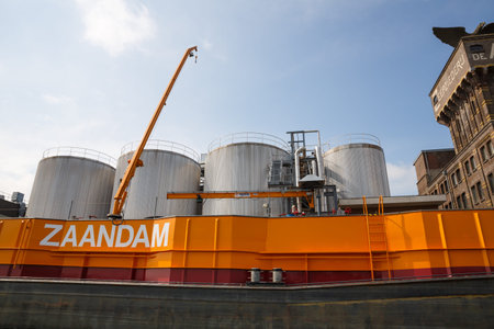 Zaanse Schans, Netherlands, August 19, 2015 - Industrial area with containers, boat and crane.