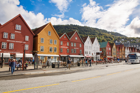 Bergen, Norway-August 17, 2014 -  Tourists and old hanseatic buildings in Bryggen in the historical part of  Norwegian city,  UNESCO World Heritage Site.のeditorial素材