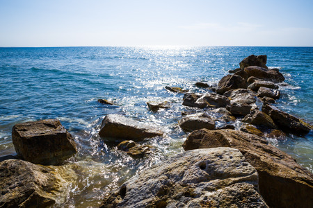 Blue Mediterranean sea with the sparkling surface and stones in Cyprus.の写真素材