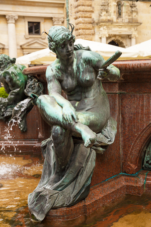 The figurine at the statue of Hygieia the goddess of health and hygiene n the courtyard of Hamburg City Hall (Rathaus), Germany.のeditorial素材