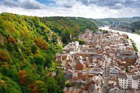 Dinant, Belgium - August 24, 2015 - The houses and bridge on the coast of Meuse river in Belgian old city.のeditorial素材