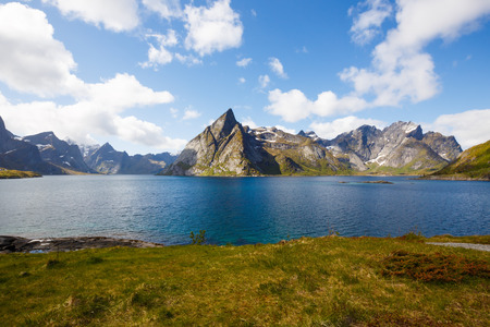 Landscape with high rocky mountains and fjord in Hamnoya, Norway.の写真素材