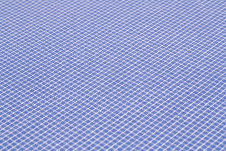 Checkered tablecloth texture as a background, closeup picture.