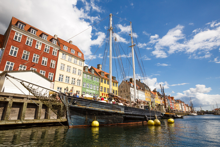 Copenhagen, Denmark - August 19, 2017 - Nyhavn district with colorful buldings, ships and bridge at the canal.のeditorial素材