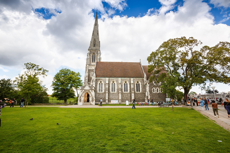 Copenhagen, Denmark-August 19, 2017 - St. Alban's church with green lawn and tourists.のeditorial素材