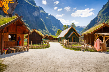 Gudvangen, Norway - June 13 - Traditional wooden houses and people in national clothes in the viking village museum.のeditorial素材