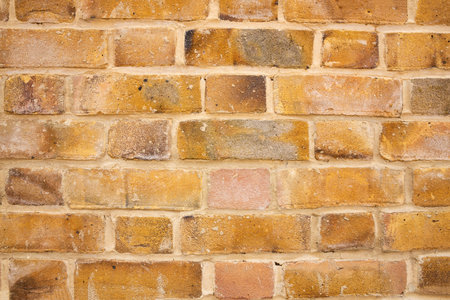 The texture of the brown bricks wall as a background.