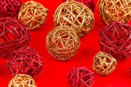 Christmas wooden colorful balls on red background.の写真素材