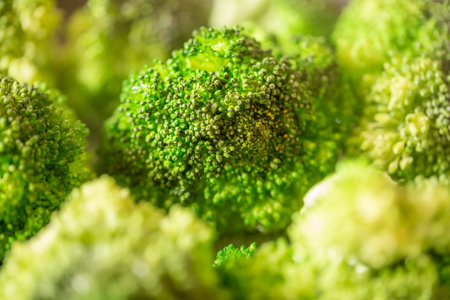 Green fresh organic broccoli close up picture.