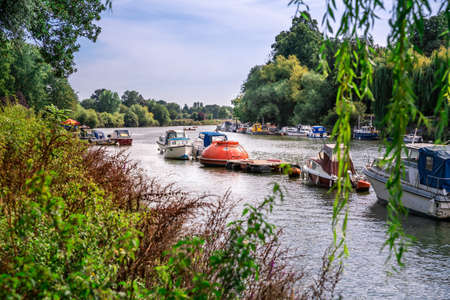 Thames riverfront with many boats in Richmond, London, UK.の写真素材