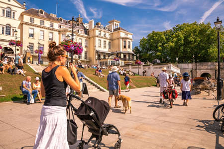 London, UK - August 24, 2019 - People relaxing at the Thames riverside in hot sunny summer day in Richmond.のeditorial素材