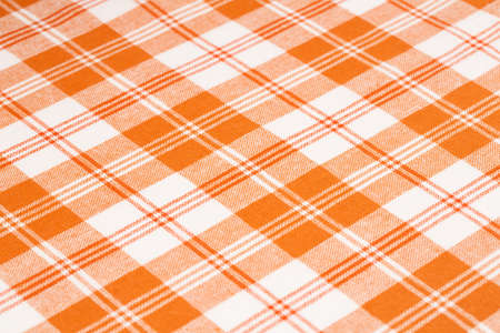 Orange and white kitchen towel texture as a background, vertical picture.の写真素材
