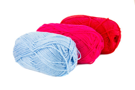 Three knitting yarn clews isolated on white background.