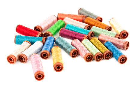 Colorful cotton thread reels close up picture.