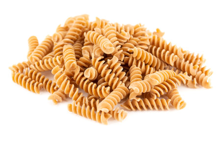 The heap of fusilli pasta isolated on white background.の写真素材