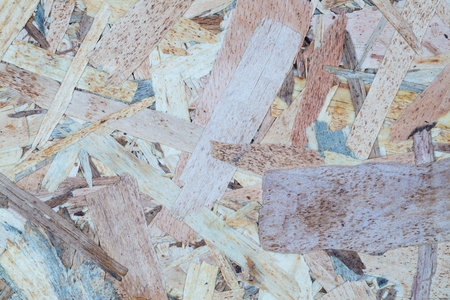 Wooden oriented strand board texture as a background.