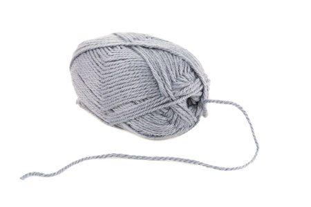 Gray knitting yarn clew isolated on white background.の写真素材