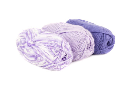 Three knitting yarn clews isolated on white background.
