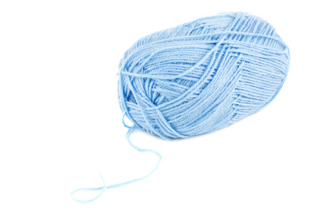 Blue knitting yarn clew isolated on white background.の写真素材