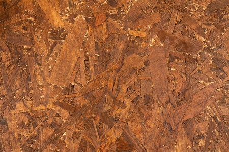 Wooden oriented strand board texture as a background.