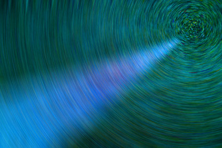 Green and blue blurred background, light ray on circle colorful backdrop.の写真素材